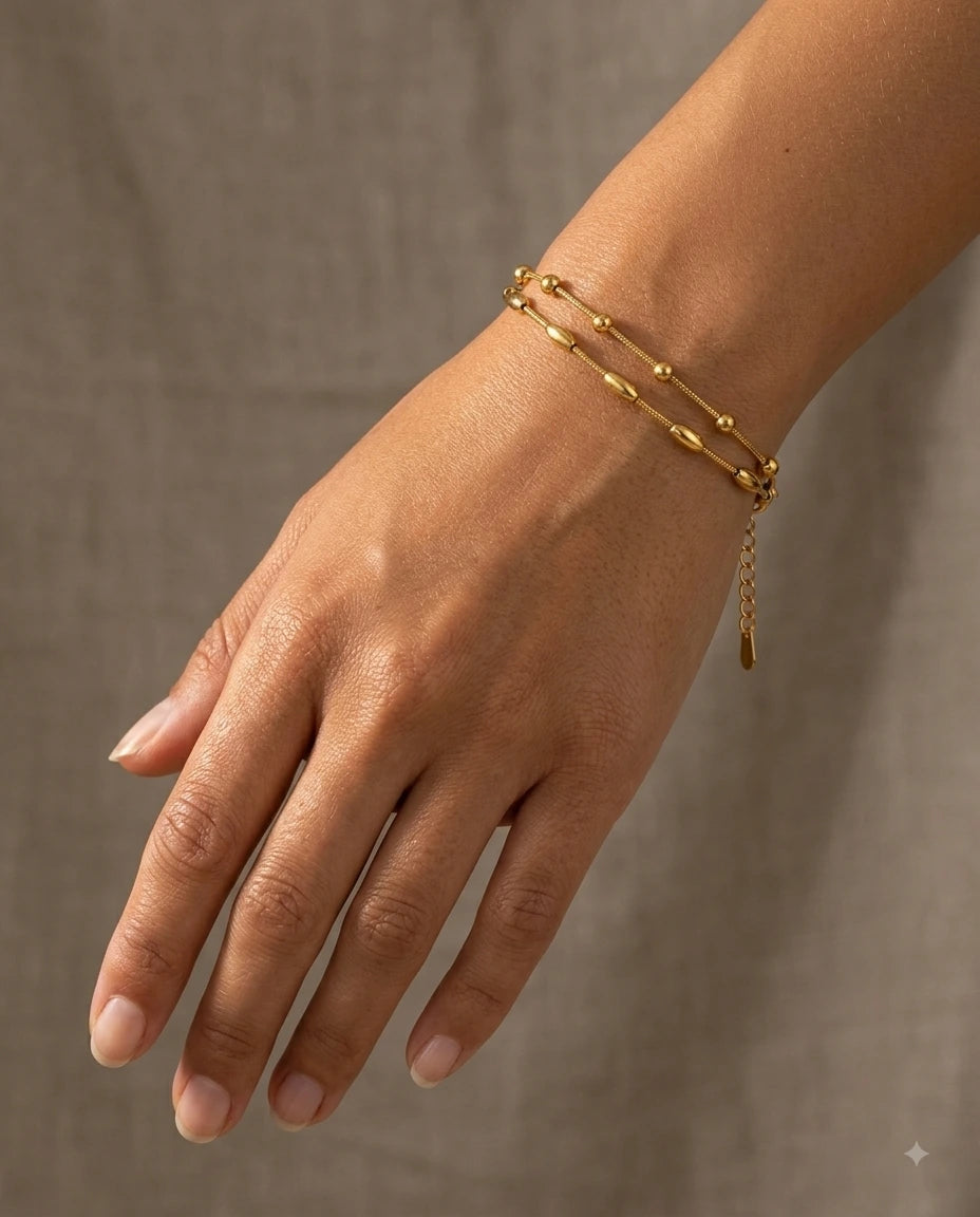 Golden Bead & Bar Bracelets worn on wrist