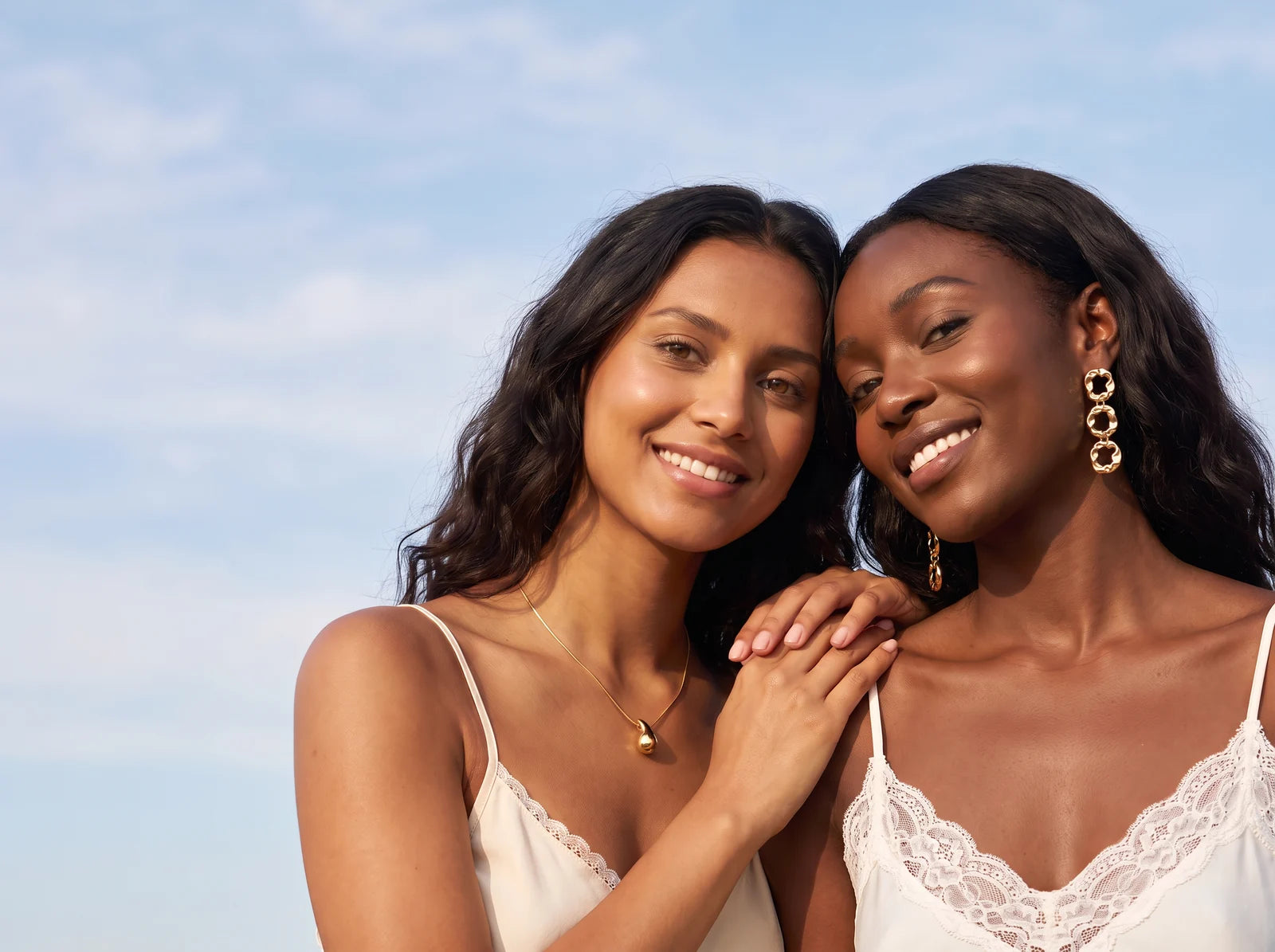 Two women wearing Nische jewellery